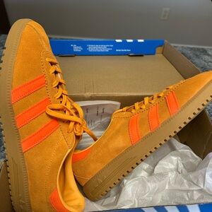 Adidas women’s (size 11)  or Men's (9.5) BRMD 'Real Gold Solar Orange' Shoes